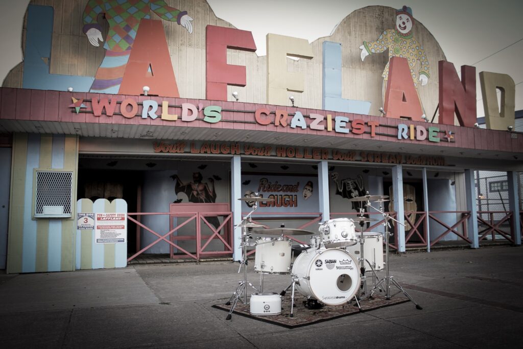 White Noise drum set in front of Laffland