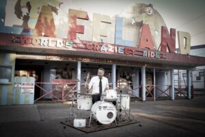 White Noise drum set in front of Laffland at Sylvan Beach