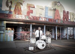 White Noise drum set in front of Laffland at Sylvan Beach