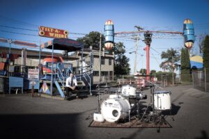 Patrick Blakley at Sylvan Beach Amusement Park with his drum set!
